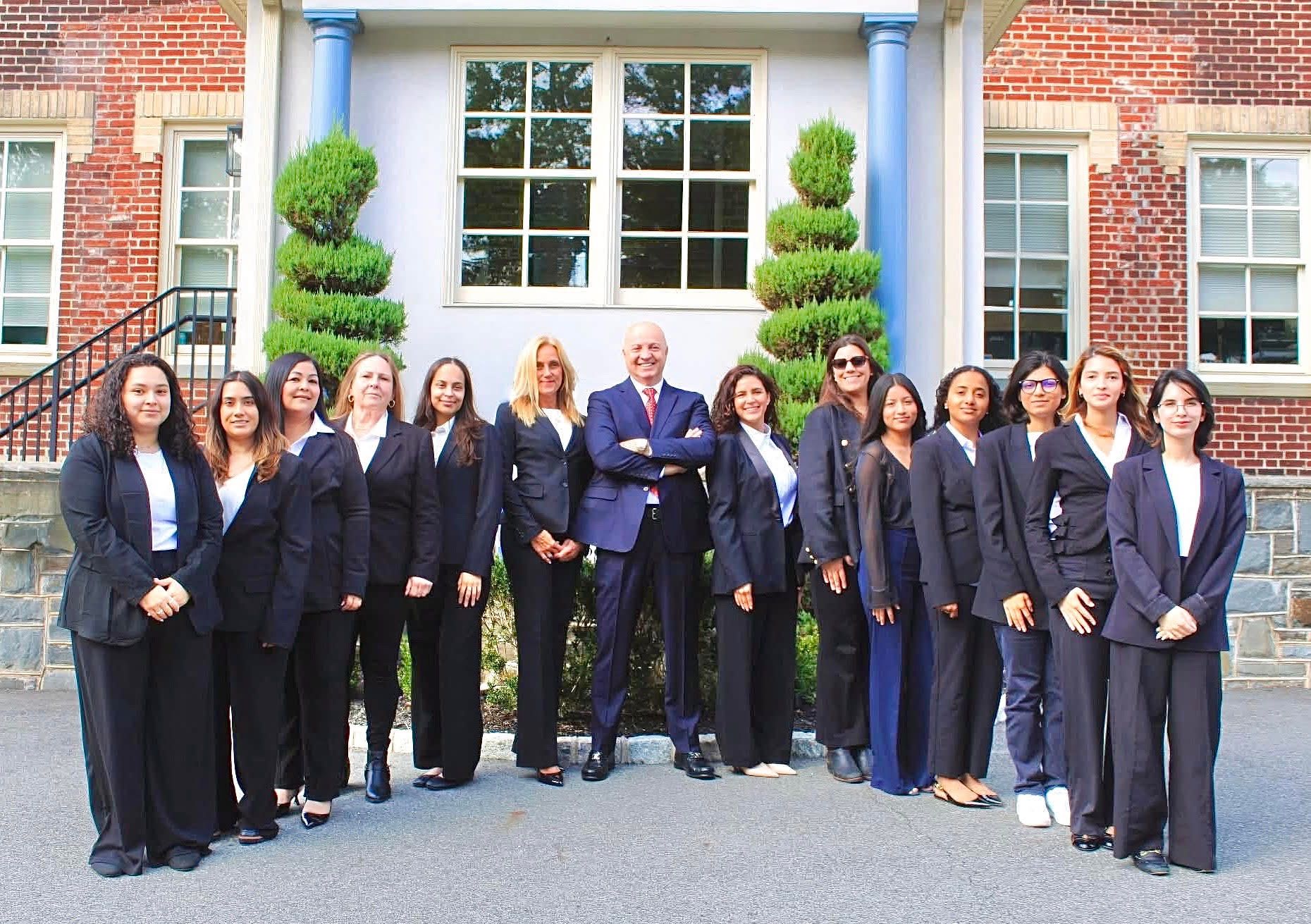 Raffi T. Khorozian, Esq., standing with the firm's staff outside the office